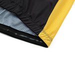 A close-up of the Dont Stop Riding Cycling Jersey Set shows the garments edge with a black outer layer and yellow textured panel. The lightweight polyester fabric is lifted to reveal blue and gray mesh lining underneath, highlighting detailed stitching and texture.