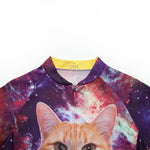 The Womens Tacos Cat Cycling Jersey Set features a vibrant space-themed design with an orange cats face on the front, set against a starry blend of purples, pinks, and teal, ideal for cosmic adventure lovers.