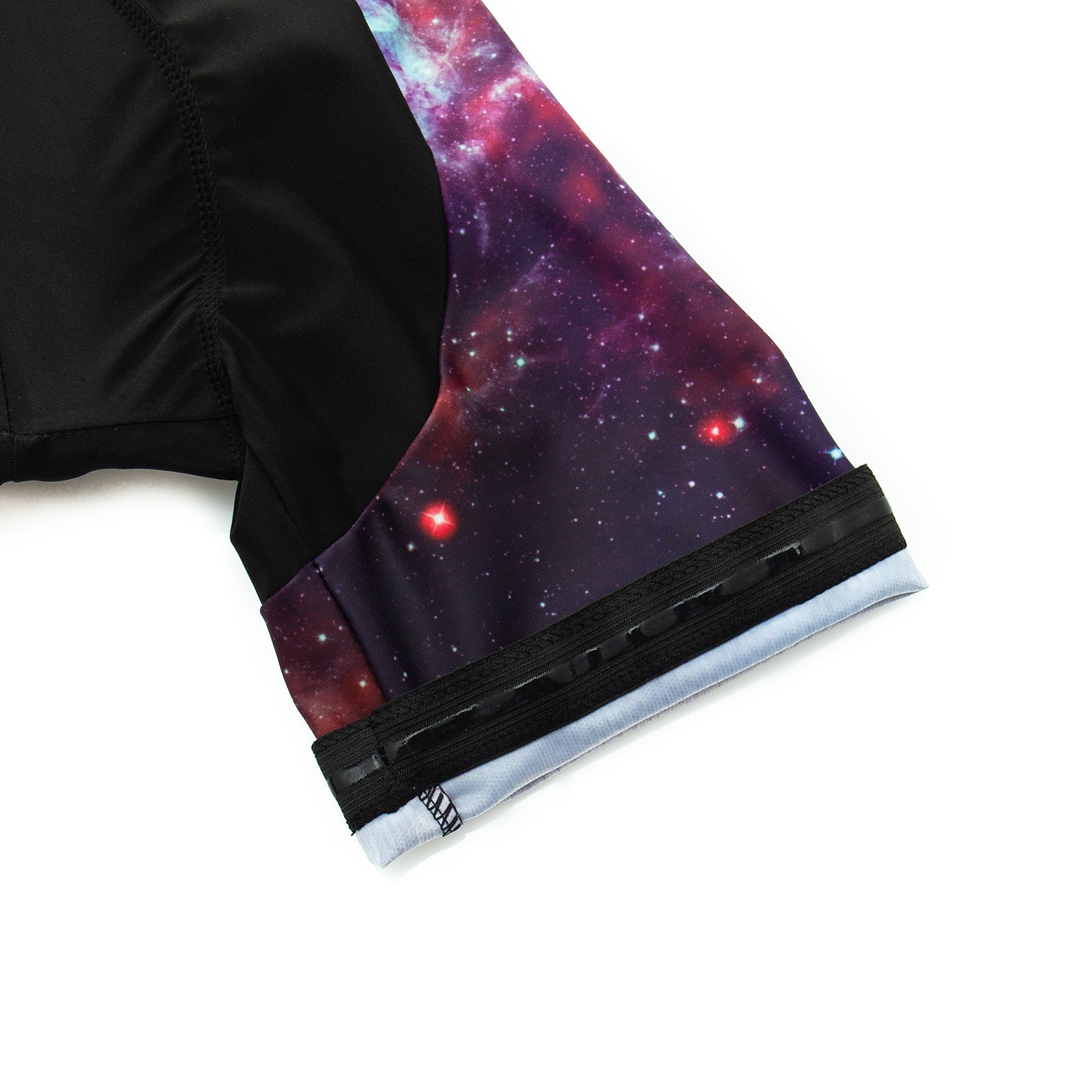 The Womens Tacos Cat Cycling Jersey Set features black-and-galaxy-themed fabric sleeves with cosmic stars and nebula patterns, capped by light blue cuffs for a striking contrast against the dark material.
