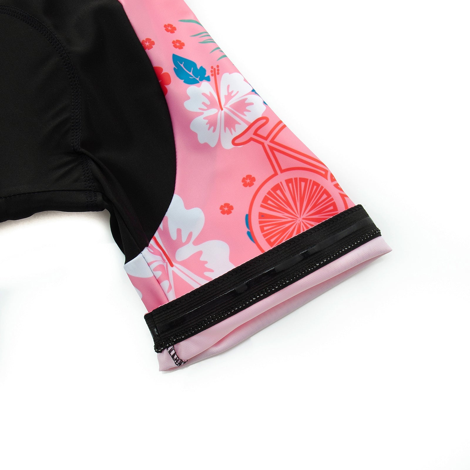 Close-up of the Womens Pink Floral Cycling Jersey Set sleeve, showcasing its floral and bicycle wheel pattern. Predominantly pink with red, orange, and white accents, it highlights a sleek black zipper detail.