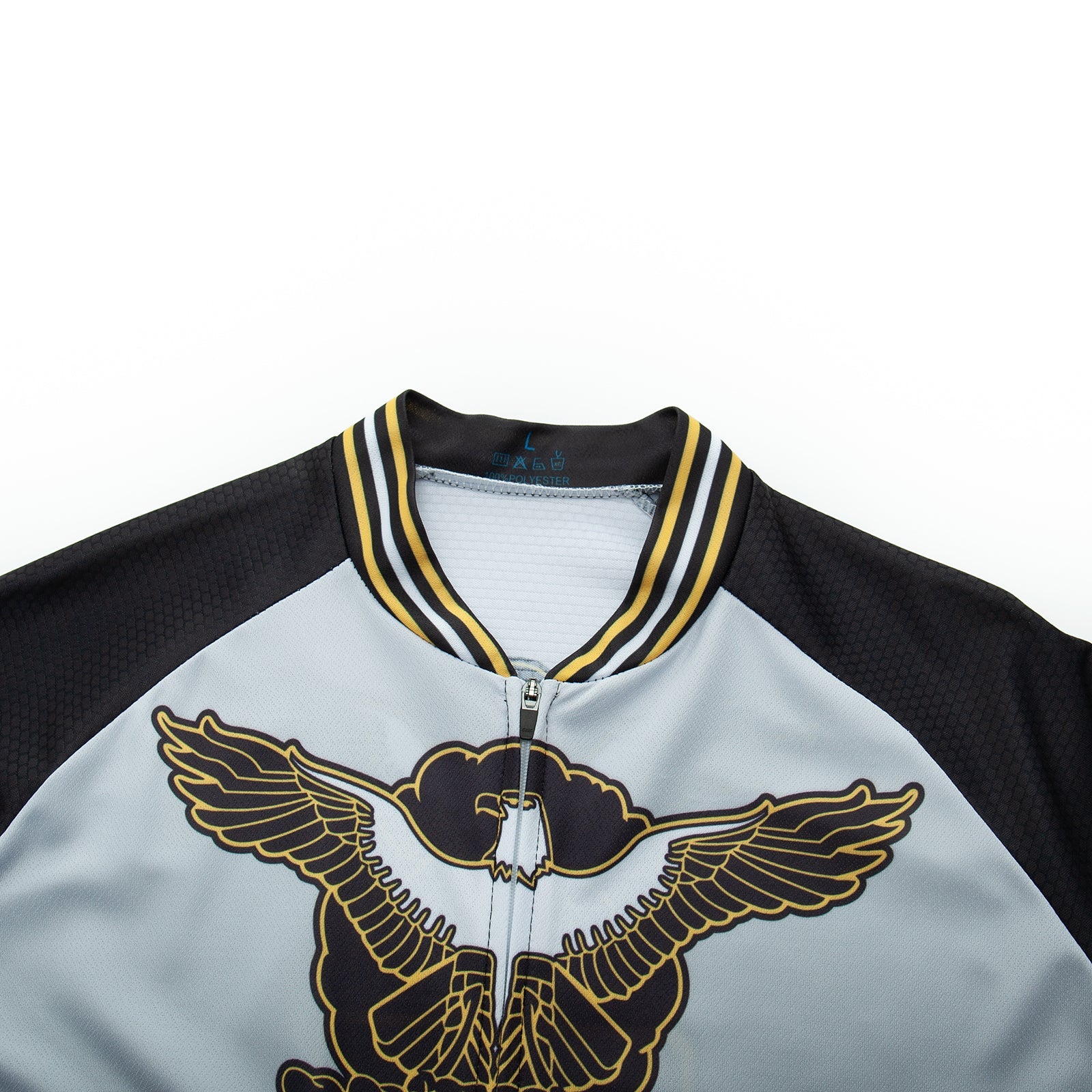 Close-up of the US Army Veteran Cycling Jersey Set, highlighted by an embroidered eagle with gold and black wings. The striped collar and sleeves give a jersey-like style, while the mainly gray body offers classic elegance.