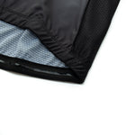 Close-up of a black fabric from the US Army Veteran Cycling Jersey Set, showing the edge and inner gray lining with a grid pattern. The athletic wear material displays texture and stitching details on a white background.