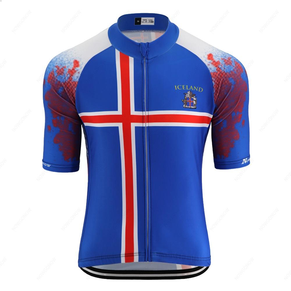 Explore the Iceland Blue Cycling Jersey, crafted from lightweight polyester. It features a blue base with red and white stripes forming an Icelandic-style cross, detailed sleeves, and the word ICELAND with a distinct crest on the chest.