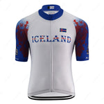 The Iceland White Cycling Jersey is designed for performance with lightweight polyester fabric. It features blue and white colors, an Icelandic flag on the chest, ICELAND in bold, and sleeves with a blue gradient design enhanced by striking red accents.