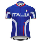 Italia Cycling Jersey, featuring ITALIA in white on a blue base, showcases an Italian flag badge on the chest. Made from lightweight polyester, it includes white curved stripes and red, white, and green accents on the collar and sleeves for enhanced performance.