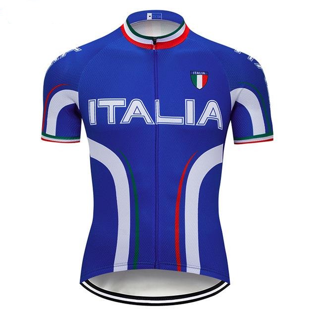 Italia Cycling Jersey, featuring ITALIA in white on a blue base, showcases an Italian flag badge on the chest. Made from lightweight polyester, it includes white curved stripes and red, white, and green accents on the collar and sleeves for enhanced performance.