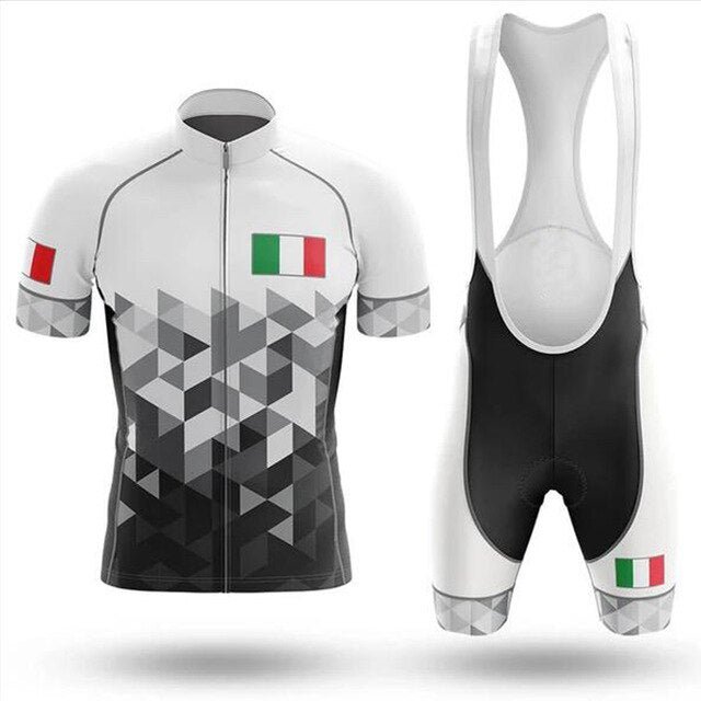 The Italy Pro Team Cycling Jersey Set includes a short-sleeve white jersey with geometric gray designs and Italian flag emblems on the sleeve and chest. The sleek black bib shorts feature white straps and the iconic Italian flag on the thighs.