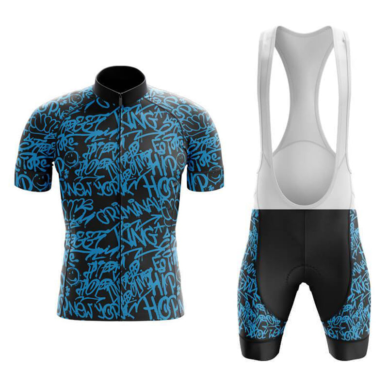 The Jazzy Blue Retro Cycling Jersey Set includes a lightweight polyester black jersey with blue graffiti-style text, short sleeves, and a collar. The bib shorts feature a white upper strap section.