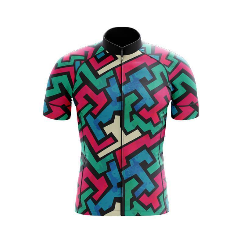 The Jazzy Lines Retro Cycling Jersey Set showcases a vibrant geometric pattern with interlocking shapes in green, pink, blue, and black. Made from lightweight polyester, this short-sleeved jersey ensures an eye-catching design.