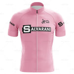 The Salvarani 1972 Retro Cycling Jersey Set features a pink design with SALVARANI in black and white across the chest and DEW elegantly scripted above. The sleeves bear SALVARANI, highlighting Felice Gimondis Grand Tours legacy, and it includes a handy front zipper.