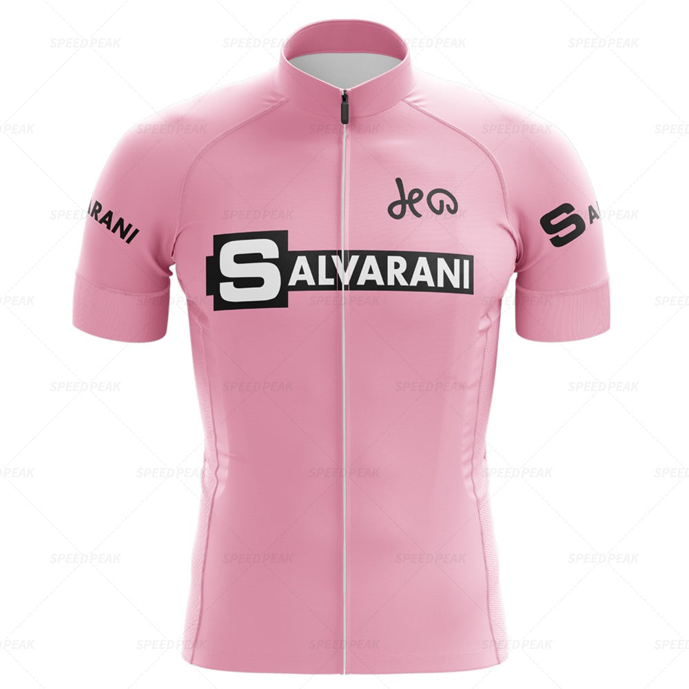 The Salvarani 1972 Retro Cycling Jersey Set features a pink design with SALVARANI in black and white across the chest and DEW elegantly scripted above. The sleeves bear SALVARANI, highlighting Felice Gimondis Grand Tours legacy, and it includes a handy front zipper.