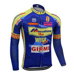 The Mercatone Uno Wega Retro Cycling Jersey features long blue sleeves with yellow and red accents, sponsor logos like Mercatone Uno Wega, Girmi, and Wegaw, geometric patterns, and a front zip closure. A cozy fleece version is also available for cooler rides.