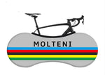 A minimalist graphic features MOLTENI in black on a gray oval, with vibrant black, red, yellow, green, and blue stripes below. A black road bike silhouette is framed by the oval, mirroring the cycling style allure of Molteni Bike Sock.