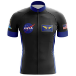 The NASA Commander Cycling Jersey is a black and blue short-sleeved performance jersey made of lightweight polyester, adorned with the NASA logo on the left chest, Commander with wings on the right chest, a mission patch on the left sleeve, and a U.S. flag on the right sleeve.