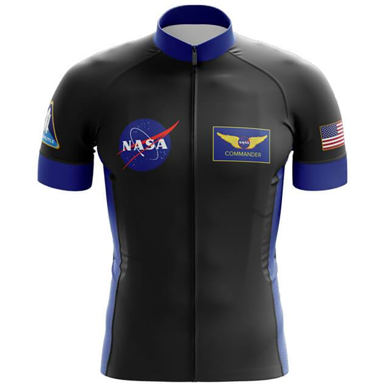 The NASA Commander Cycling Jersey is a black and blue short-sleeved performance jersey made of lightweight polyester, adorned with the NASA logo on the left chest, Commander with wings on the right chest, a mission patch on the left sleeve, and a U.S. flag on the right sleeve.