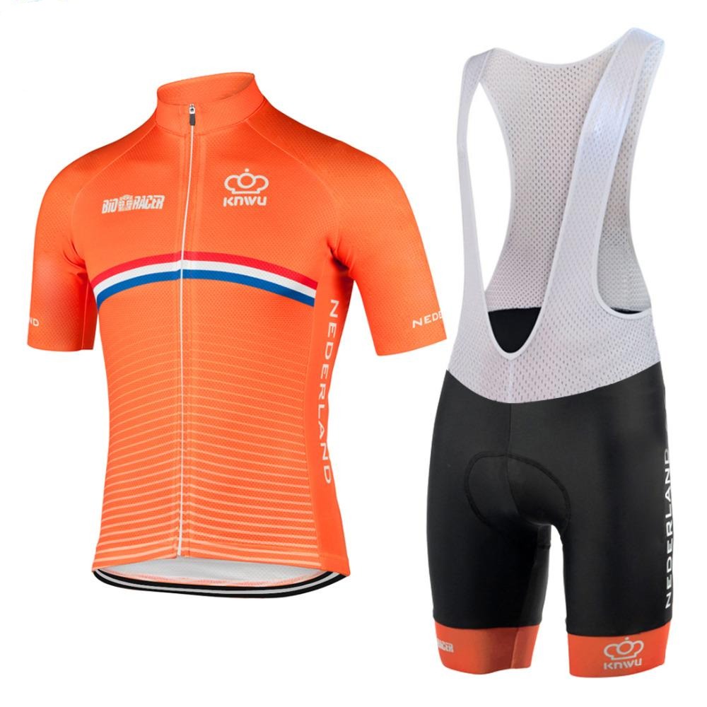 The Netherlands Cycling Team Retro Cycling Jersey Set includes an orange jersey with Nederland text, a zipper, and a white, blue, and red chest stripe. The black bib shorts feature white straps and an orange band at the leg ends, representing the classic team style.