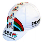 The PDM Retro Cycling Cap boasts classic retro design with a white base, multicolored stripes, and logos of PDM Chrome Cassettes and ULTIMA, evoking vintage cycling or racing style.