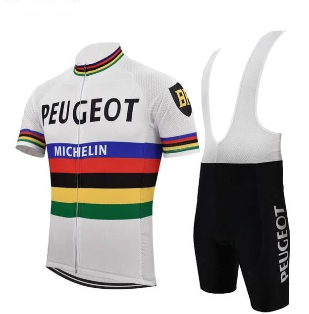 The Peugeot BP Michelin Retro Cycling Jersey Set features a white jersey with colorful stripes and PEUGEOT and MICHELIN logos, echoing the classic style of Eddy Merckx. The black bib shorts are adorned with the PEUGEOT logo on the leg for an authentic retro look.