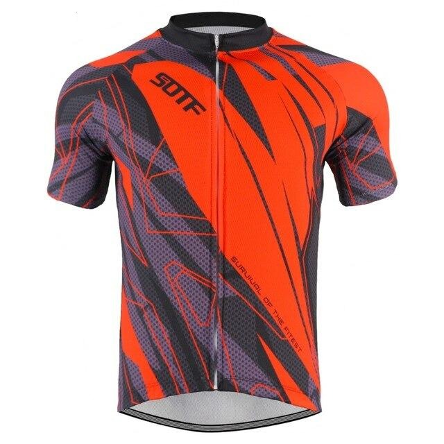 Introducing the Red Pattern Cycling Jersey: a vibrant, lightweight polyester jersey featuring an abstract design in red, black, and purple with geometric patterns. It has short sleeves, a front zipper, and boldly displays SURVIVAL OF THE FITTEST on the front.