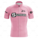 The Salvarani 1972 Retro Cycling Jersey Set features a pink design with SALVARANI in black and white across the chest and DEW elegantly scripted above. The sleeves bear SALVARANI, highlighting Felice Gimondis Grand Tours legacy, and it includes a handy front zipper.
