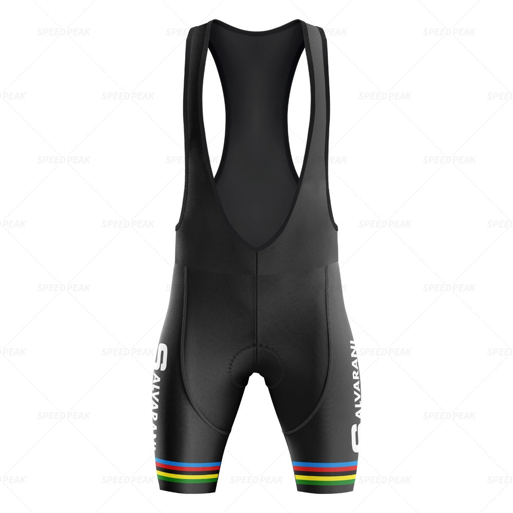 The black cycling bib shorts feature rainbow stripes on the leg bands and vertical SAVARAN text, reminiscent of a retro jersey. This design honors the Salvarani 1972 era with shoulder straps and padded seat area, part of the Salvarani 1972 Retro Cycling Jersey Set.