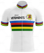 The Tomasso Team Z Vetements Retro Cycling Jersey Set includes a white jersey with colorful horizontal stripes in blue, red, black, yellow, and green. It features a cartoon explosion graphic with a Z and TOMMASO VETEMENTS, reminiscent of Team Z and Greg LeMonds iconic retro style.