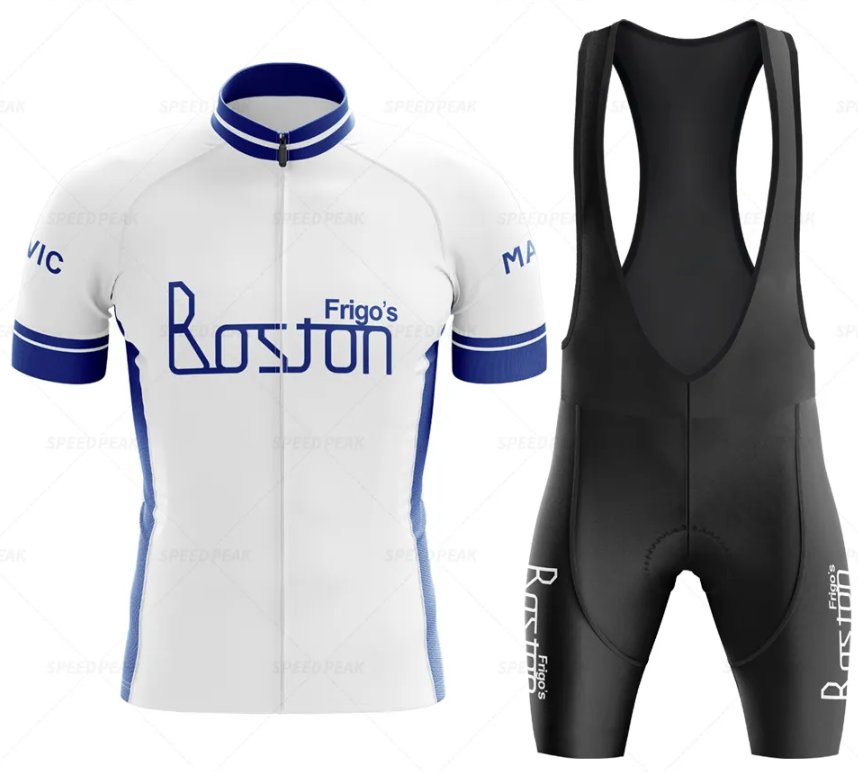 The Frigos Boston Retro Cycling Jersey Set features a white and blue jersey with a blue-trimmed design, paired with black bib shorts displaying Boston on the side. Both pieces are branded by Frigos and MAAP, offering style and breathable comfort for your ride.