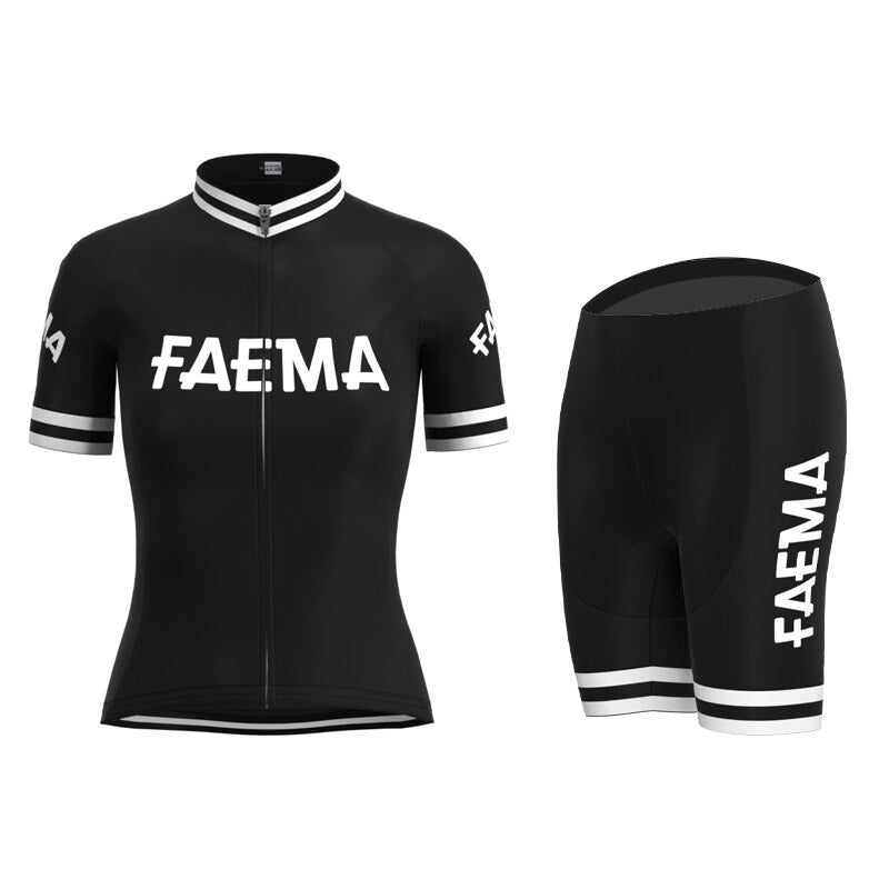 The Womens Faema 1955 Retro Cycling Jersey Set includes a classic black jersey and shorts with iconic white FAEMA text on the chest, sleeves, and shorts. It features a front zipper and white striped cuffs, embodying the timeless charm of a 1955 cycling jersey.