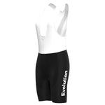 Introducing the Womens Evolution Cycling Jersey Set: a chic sleeveless black and white cycling bib with Evolution in white on the right leg, featuring a white upper transitioning into black shorts—ideal for any adventure.