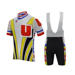 The Super U Raleigh Retro Cycling Jersey Set includes a jersey and bib shorts, ideal for 1989 Tour de France fans. The jersey features a bold design with red, yellow, black, and blue accents centered around a large red U, while the bib shorts include matching colored side stripes.