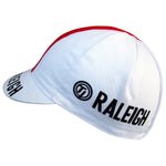 The TI Raleigh Retro Cycling Cap sports a classic white design with a bold red stripe on top and features a circular logo and RALEIGH in black on the side, reflecting the iconic style of the TI Raleigh team.