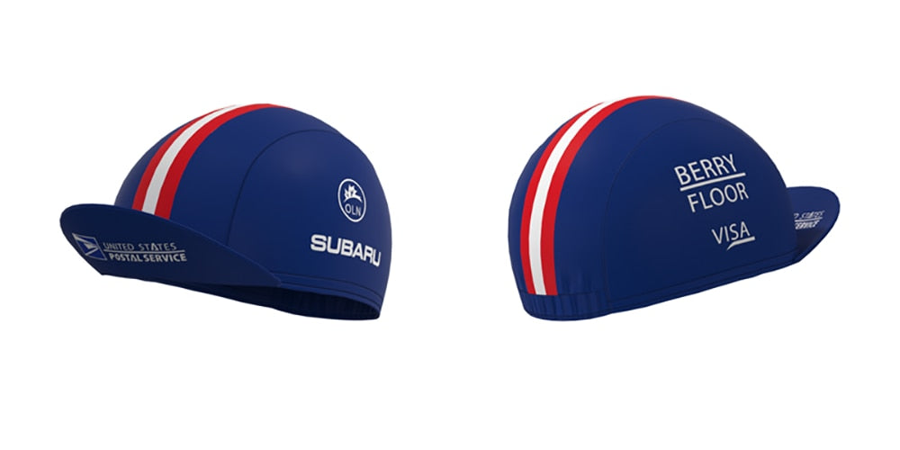 The US Postal Service Retro Cycling Cap comes in blue with red, white, and blue stripes. One cap bears logos for the US Postal Service, Subaru, and Giro, while the other displays Berry Floor, Visa, and Tour de France logos—ideal for collectors of vintage cycling apparel.