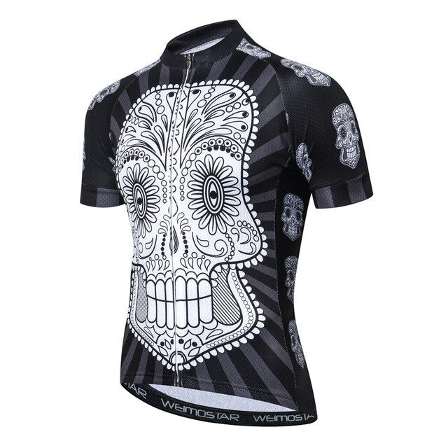 The White Skull with Black Body Cycling Jersey features a bold white sugar skull on the front, smaller skulls on the sleeves, a short neck zipper, and Weimostar branding along the bottom hem, making it ideal for enthusiastic cyclists.