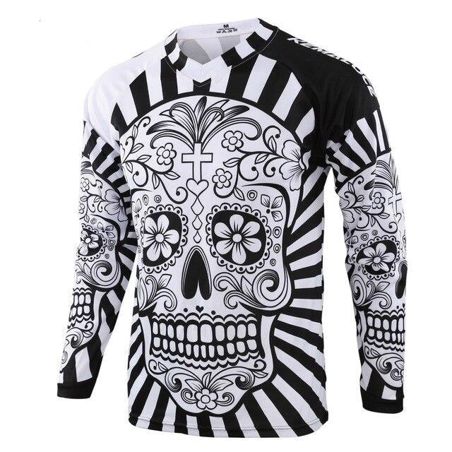 The White Skull Cycling Jersey features a black-and-white sugar skull design with floral patterns and crosses on a bold striped background. Made from lightweight polyester, this stylish jersey combines comfort and flair for your rides.