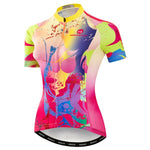 The Womens Coloured Splash Cycling Jersey features a vibrant abstract design in pink, yellow, blue, and green on lightweight polyester. It includes short sleeves, a front zipper, a collar, and a silicone waist strip for security—all highlighted by dynamic patterns and a stitched brand logo.