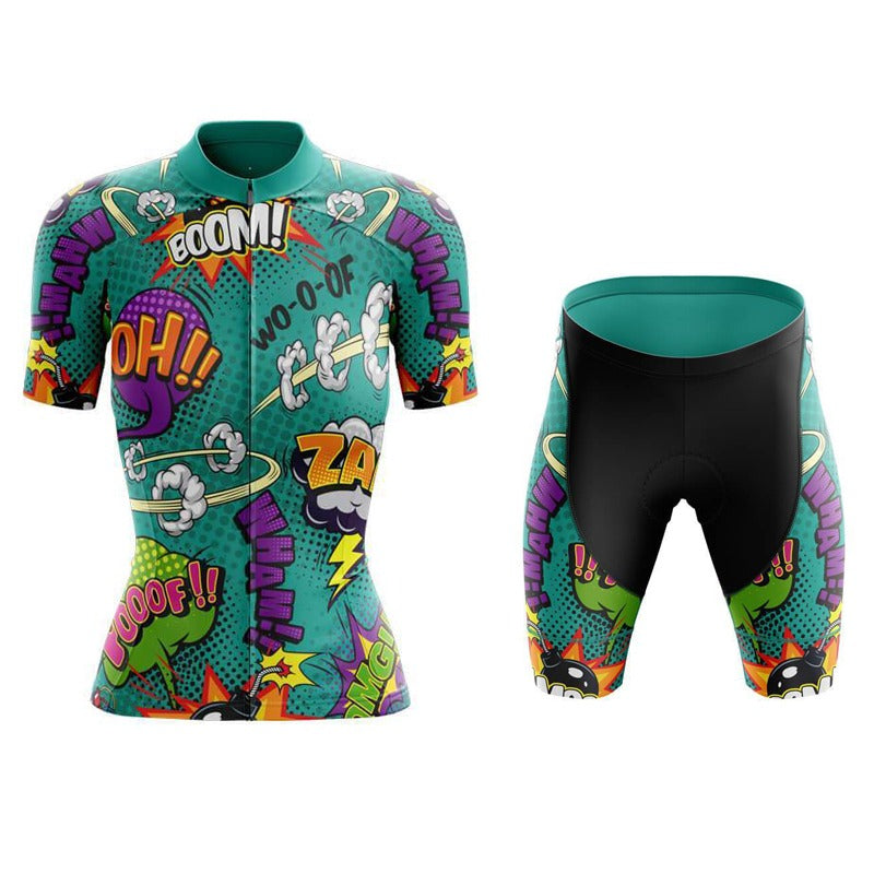 The Womens Explosive Comic Book Green Cycling Jersey Set features a colorful comic book design. The short-sleeve top and shorts display words like Boom! and Zap! in vibrant green, purple, orange, and yellow tones for a dynamic, playful look.