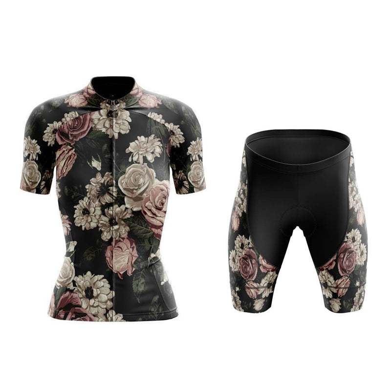 The Womens Floral Vintage Cycling Jersey Set features a jersey with short sleeves and a front zipper, adorned with pink and cream roses on a dark backdrop. The matching shorts have a plain black upper section, presenting an elegant look against the white background.