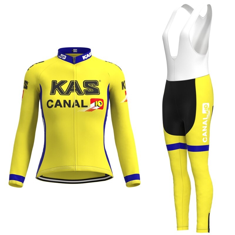 Embrace the classic style with the Womens KAS Canal Retro Cycling Jersey Long Set, featuring a striking yellow jersey with KAS and Canal 10 logos, blue accents, and matching bib tights. This winter fleece set offers a cohesive look with similar branding and white straps.