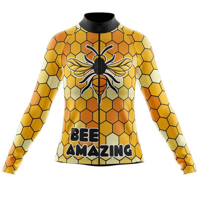 The Womens Long Sleeve Bee Amazing Jerseys feature a honeycomb pattern in vibrant yellow and orange with a large bee design on the chest and BEE AMAZING on the front, capturing its unique bee-themed essence.