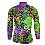 The Womens Long Sleeve Floral Design Cycling Jersey showcases a lively floral print with purple, green, yellow, and pink flowers on a multicolored background. It includes a front zipper, a purple collar, and an optional fleece lining for extra warmth on cooler rides.
