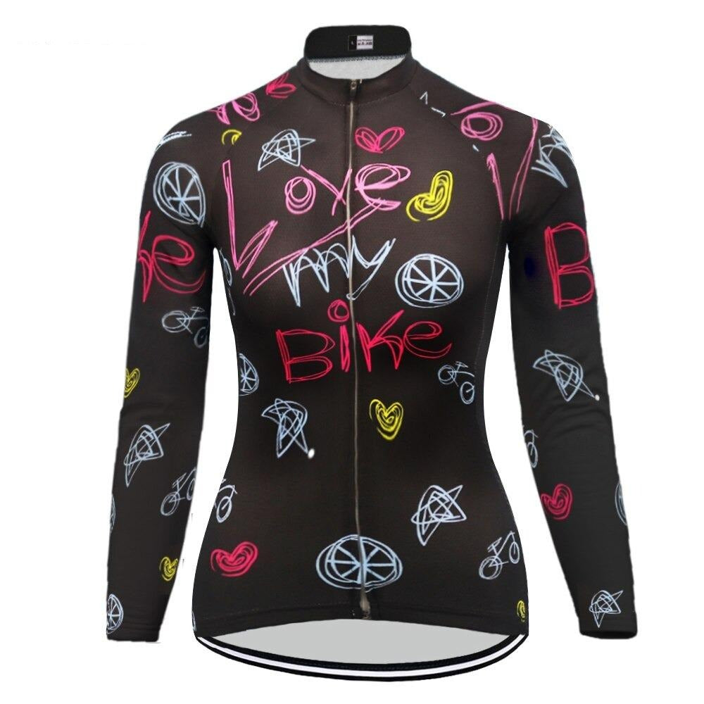 The Womens Long Sleeve Love My Bike Cycling Jersey features vibrant designs with phrases like Love my Bike, bike wheels, and hearts in pink, yellow, and blue on black. It includes a full front zipper for style and function.