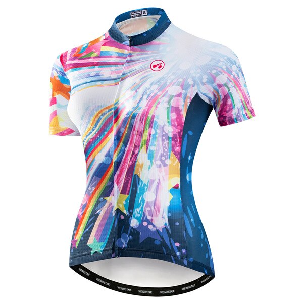 The Womens Stardust Cycling Jersey is a performance piece with a vibrant stardust design in pink, blue, white, and orange. It has short sleeves, a zippered front, a fitted style, and the brand logo on the chest.
