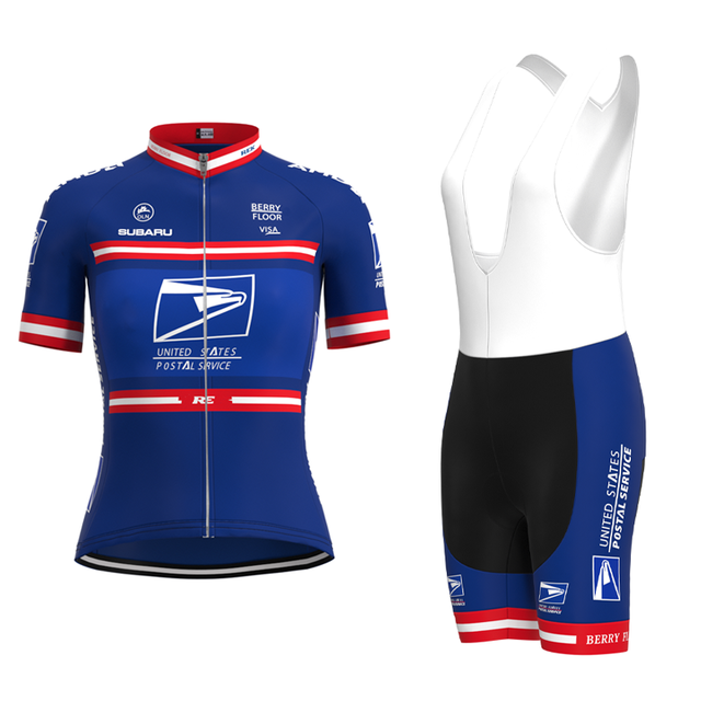 The Womens US Postal Service Jersey Set includes a blue and white cycling jersey with red and white stripes, logos, and text, paired with breathable shorts featuring the Subaru logo for comfortable rides.