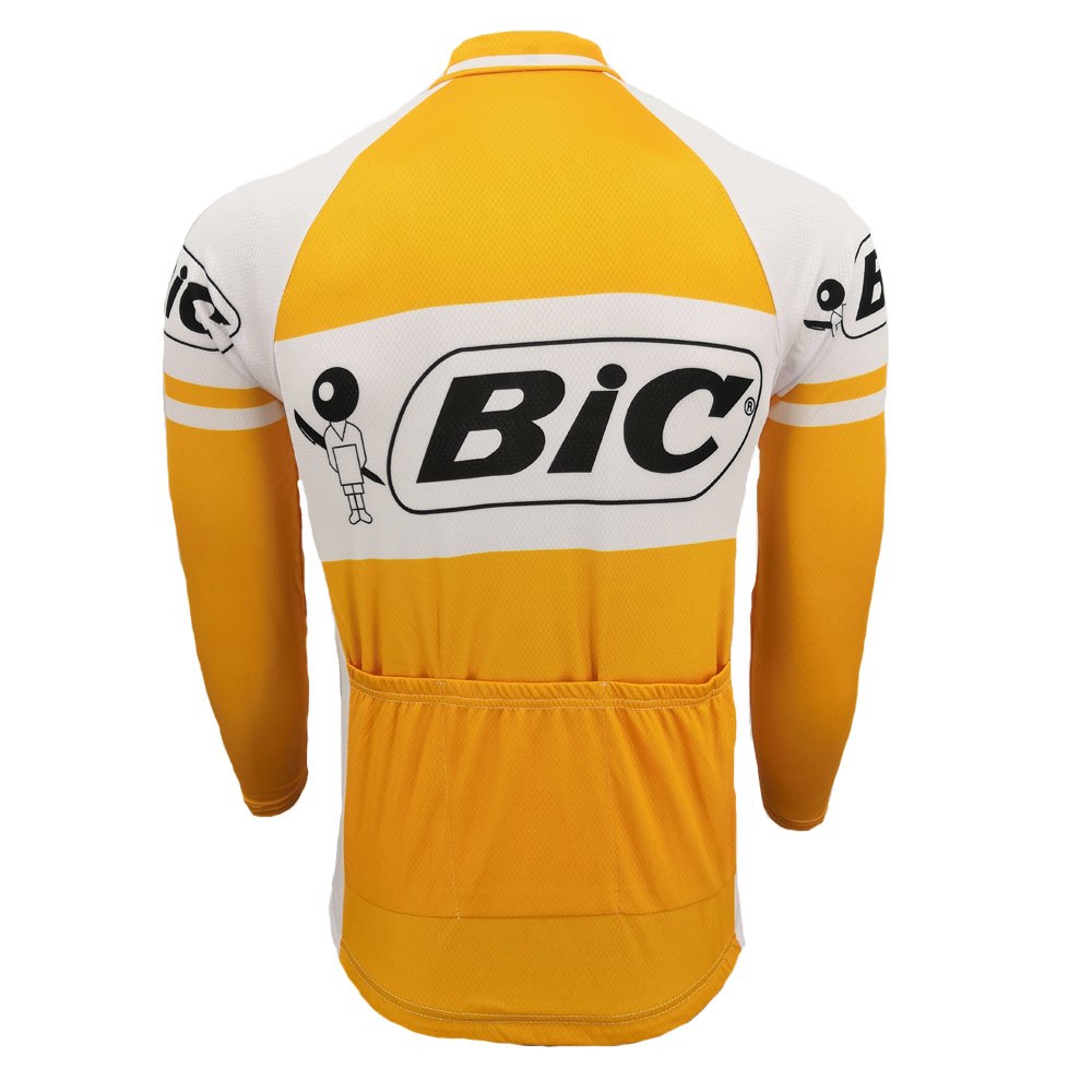 The BIC Yellow Long Sleeve Retro Cycling Jersey, available in a fleece option, features a white and orange design with the Bic logo and figure on the back and sleeves. Made from lightweight polyester, it includes pockets on the lower back for a sporty look.