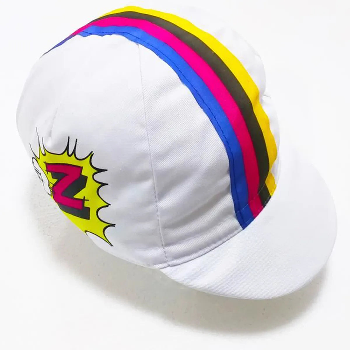 Against a plain backdrop, the Vetements Team Z Retro Cycling Cap showcases colorful blue, red, and yellow stripes along the top. The design nods to retro style with a yellow comic-style explosion and pink Z for Vetements Team Z on the side.
