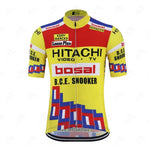 The Hitachi Bosal Eddy Merckx Retro Cycling Jersey is vibrant yellow with red and blue geometric patterns, featuring sponsor logos like Hitachi, Bosal, and B.C.E. Snooker in black text on red and white panels. It has short sleeves and a front zipper for a vintage touch.