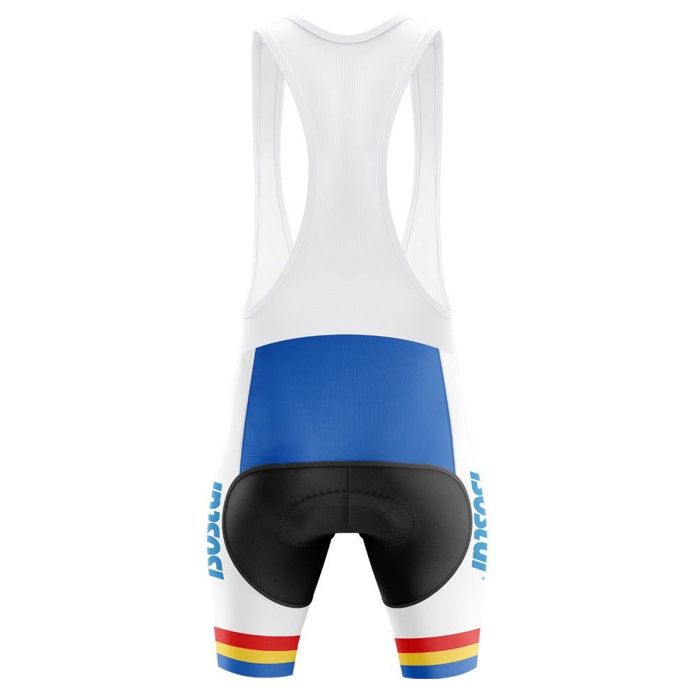 The Panasonic-Isostar Retro Cycling Jersey Set features a rear view with a white top, blue back panel, and black padded shorts. Made of lightweight polyester, the legs include red, yellow, and blue stripes near the hem with ISOREX printed on the sides.