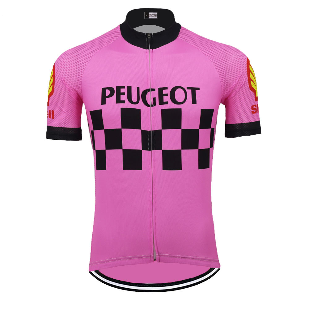 The Peugeot Shell Retro Cycling Jersey boasts a bold PEUGEOT logo across the chest on a classic pink backdrop with a black-checkered pattern. Yellow and red sleeve details add flair, while black accents on the cuffs and collar complete the retro design.