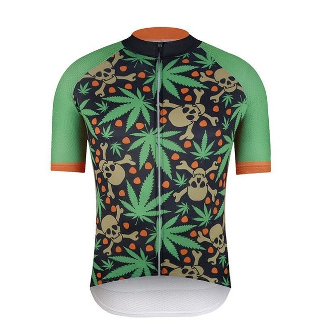 The Green Leaf Cycling Jersey features a vivid pattern of green leaves, brown skulls, and small red dots. Made from lightweight polyester, it offers light green sleeves with orange trim that match the black front zipper seamlessly.
