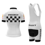 The Womens 1960s Peugeot-Shell Retro Cycling Jersey Set features a rear view of the white jersey with a checkered pattern and sleeve logos, while the shorts have suspenders and side branding, capturing the timeless essence of retro cycling apparel.